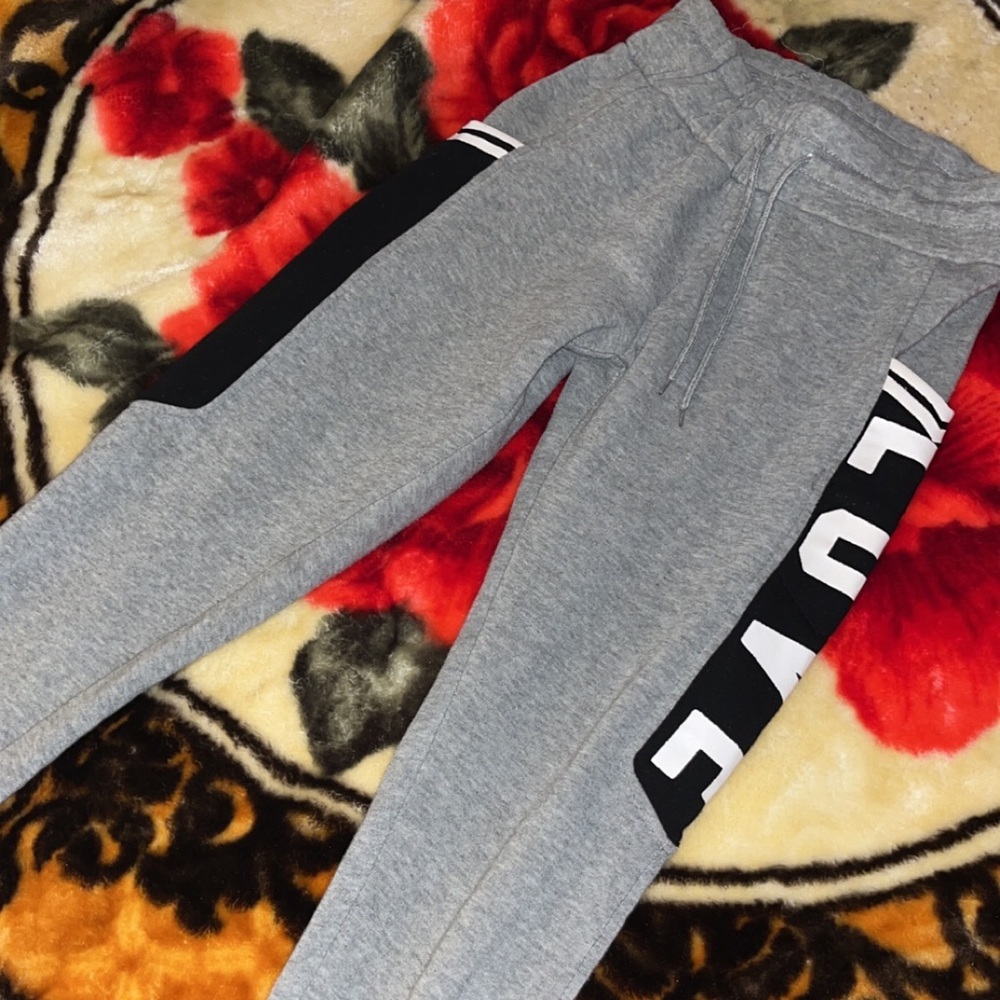 Grey Sweatpants with black like side pockets
